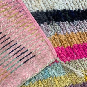 Multicolor Textured Handwoven Rug with Pink Border