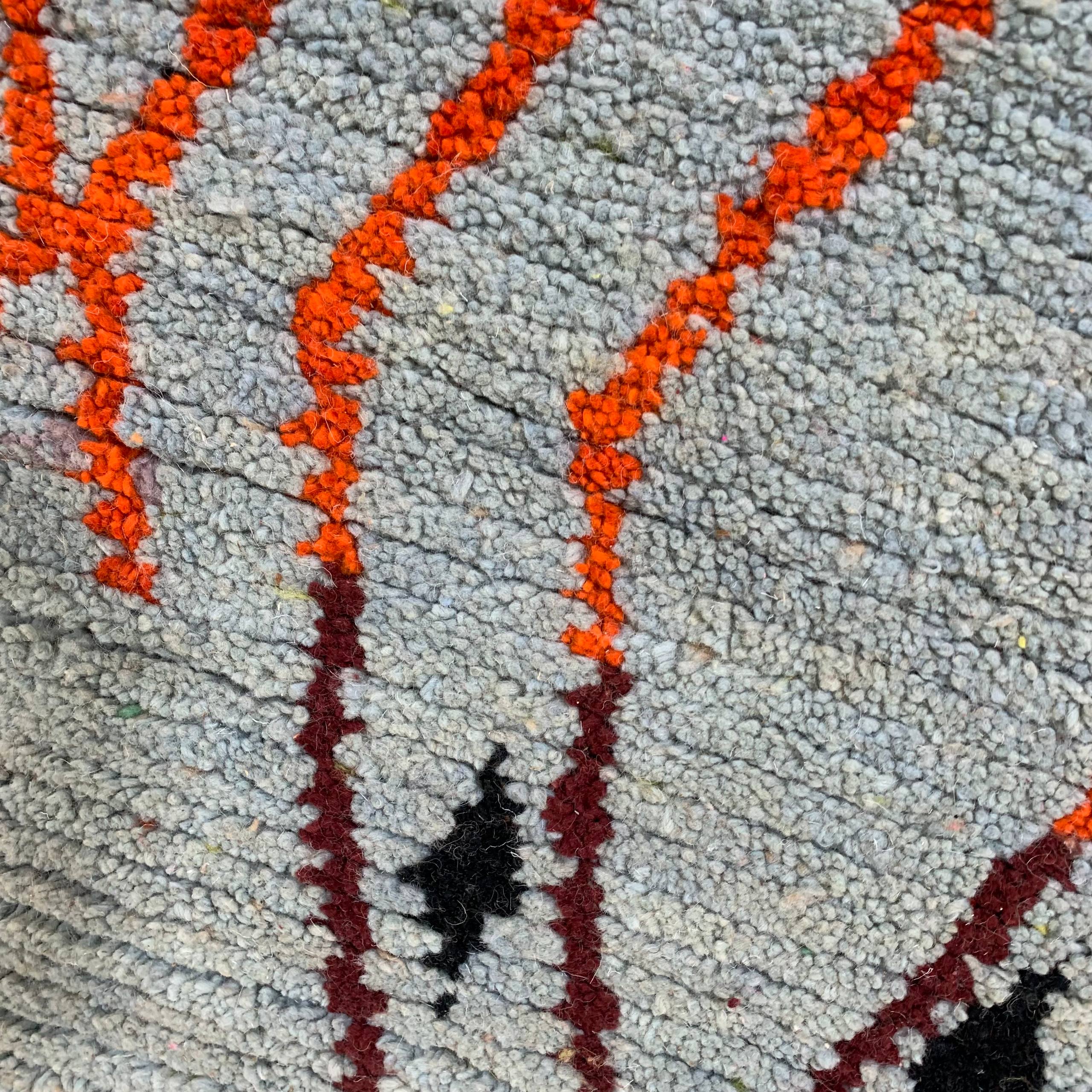 Textured Gray Rug with Orange and Burgundy Zigzag Pattern