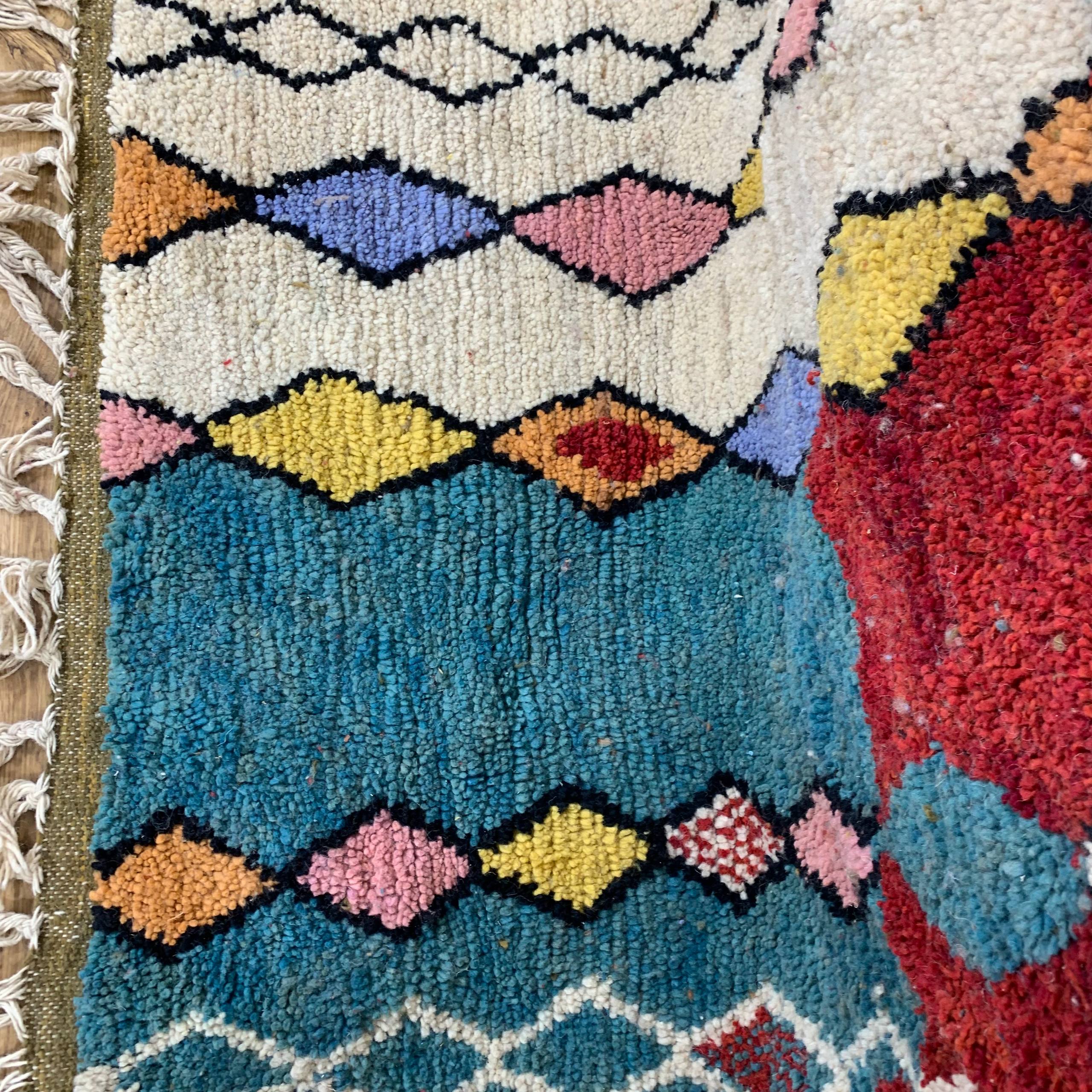 Colorful Geometric Tufted Rug with Diamond Pattern and Fringe